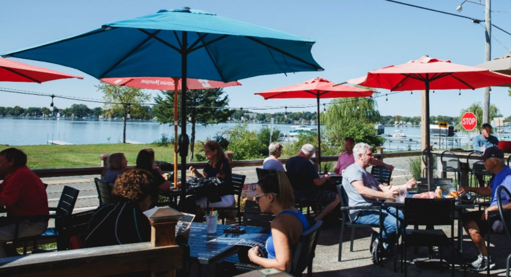 Sitting lakefront while dining on seafood dishes
